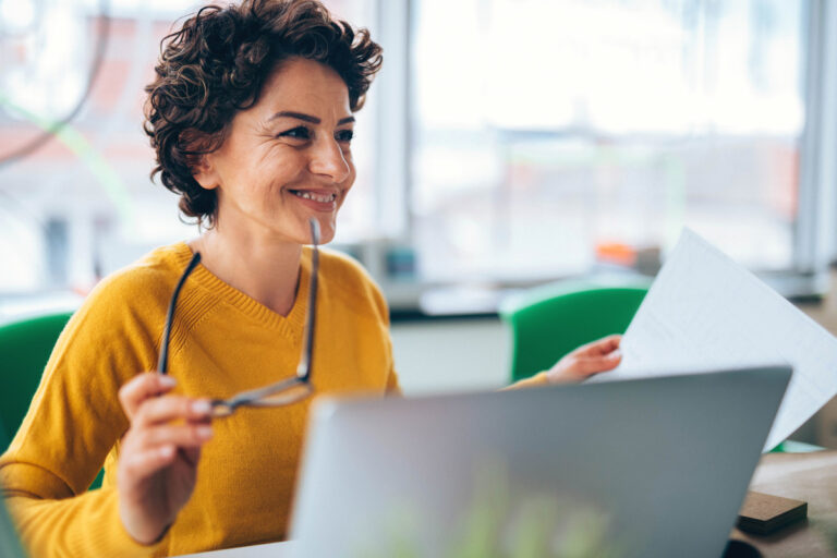 image of woman sitting at laptop