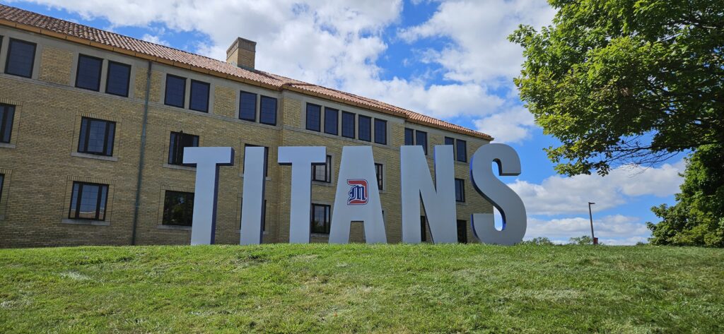 image of the university campus with Titans sign